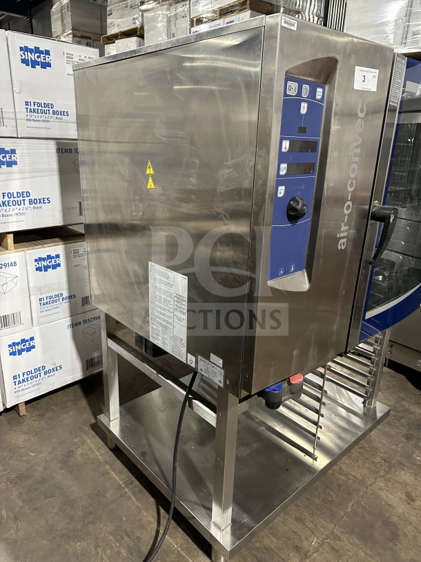 Electrolux Air-O-Steam Combi Oven, Model A0S102GCP1, stainless steel, natural gas, touch controls, with open storage beneath.