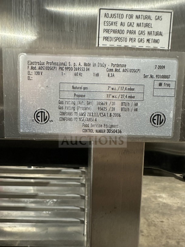 Electrolux A0S102GCP1 commercial combi convection oven, stainless steel, natural gas, model/serial tag visible.