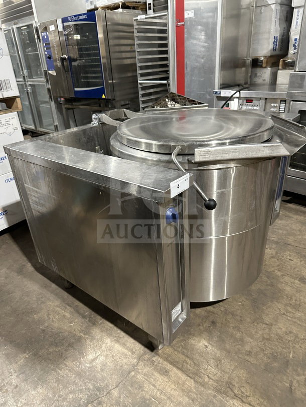 Electrolux stainless steel tilting boiling pan, model CKU5HOEOOOO, gas-powered, heavy-duty, with legs, in good condition.