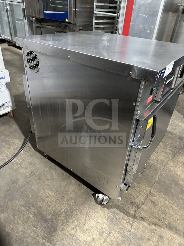 Stainless steel Winston Industries CAC507GR CVap half-size undercounter cook-n-hold oven on casters, electric, 208V.
