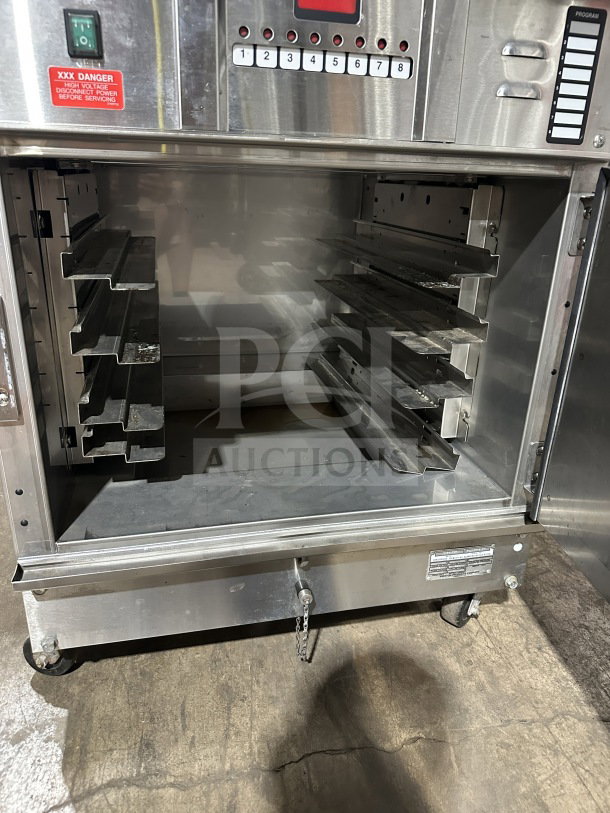 Winston Industries CAC507GR stainless steel undercounter oven, features digital controls, open interior, on casters, 208V.
