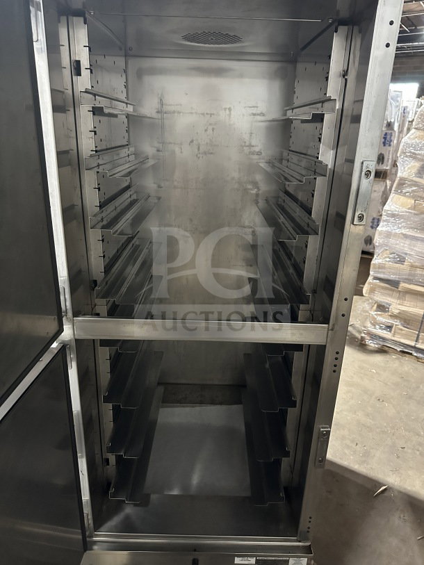 Winston Industries Cvap-4000A half-door heated holding cabinet in stainless steel, model HA4522GE, with pan racks, on casters.
