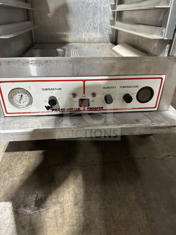 Wilder Model 910069R stainless steel heated food warmer/proofing cabinet, single door, on casters, control dials visible.