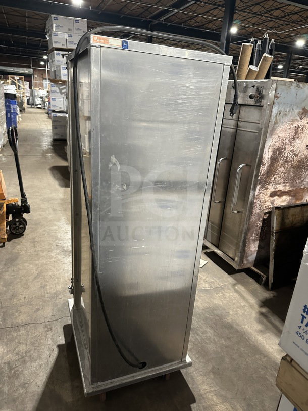 Wilder stainless steel heated food warmer, model 910069R, on casters, single door, good condition, visible serial number.