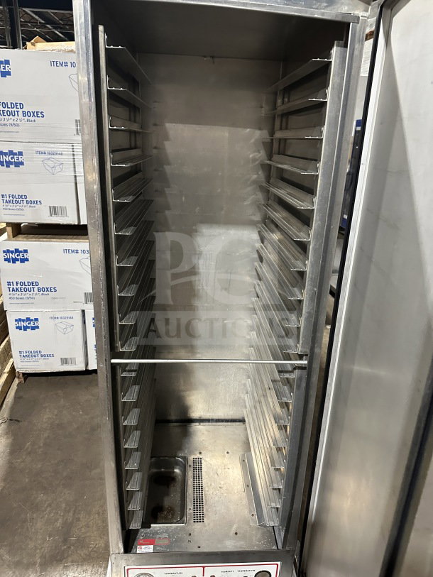 Wilder stainless steel single door heated food warmer, model 910069R, on casters. Interior racks, used condition.