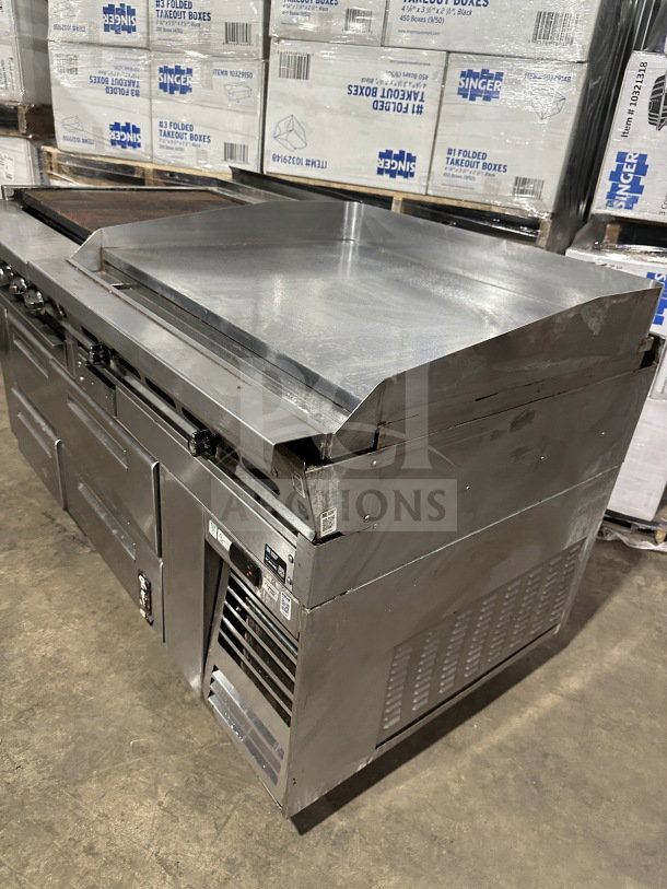 Stainless steel 4-drawer refrigerated chef base with gas charbroiler and griddle on casters, commercial use.