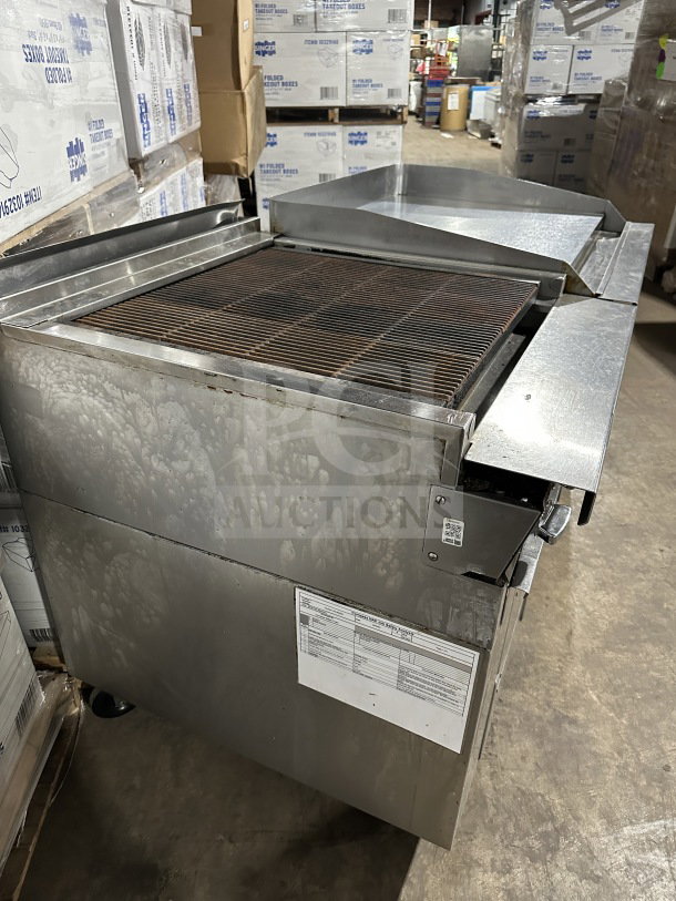 Stainless steel 4-drawer refrigerated chef base with gas radiant charbroiler and griddle on casters, good condition.