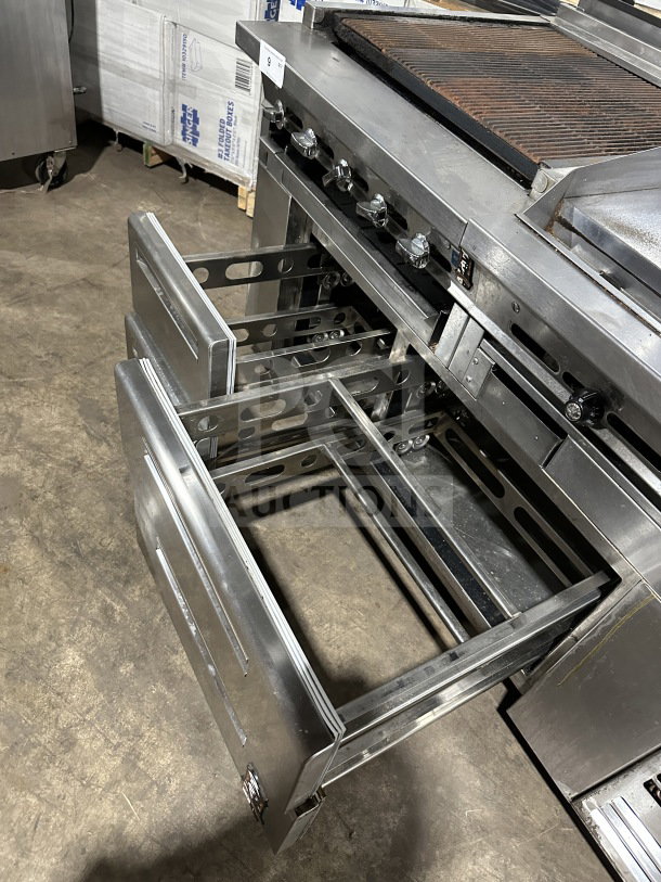 Stainless steel 4-drawer refrigerated chef base with gas radiant charbroiler and griddle, on casters, good condition.