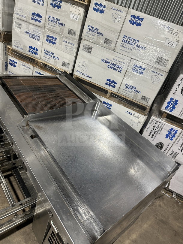 Stainless steel 4-drawer refrigerated chef base with gas radiant charbroiler and griddle, on casters. Good condition.