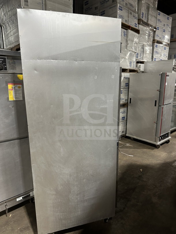 Traulsen commercial stainless steel 2-door reach-in freezer, model G22012, with poly-coated rack and casters, SN: T6898J07.