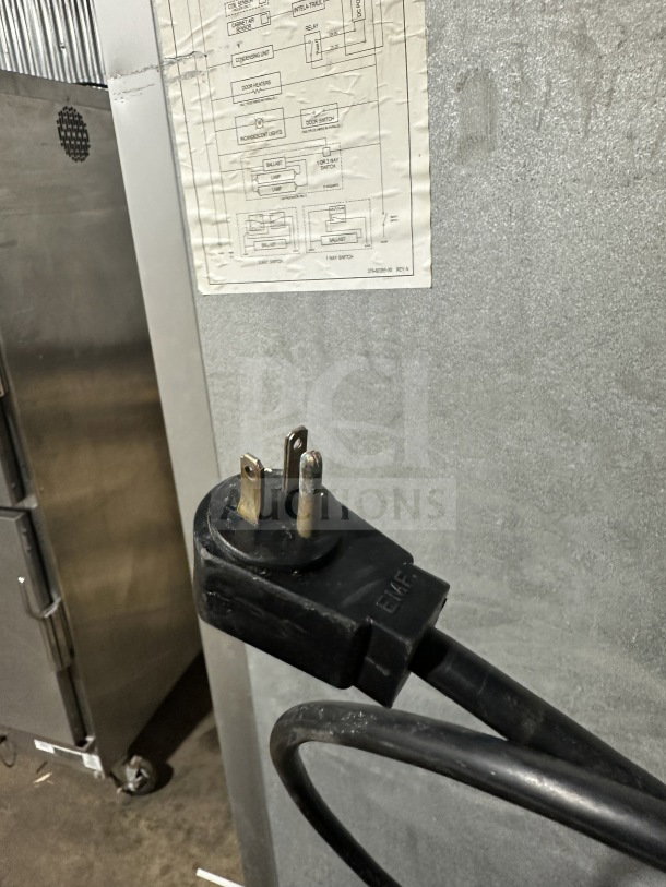 Traulsen G22012 stainless steel 2-door reach-in freezer with poly-coated rack, 115V, 1 phase, on casters. Model G22012, SN T6898J07.