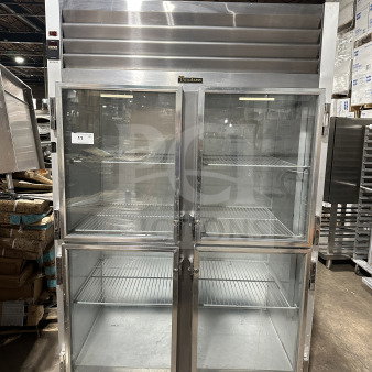 Traulsen G21000 commercial refrigerator, stainless steel, 2-section, 4-half glass doors, poly-coated wire racks, on casters.
