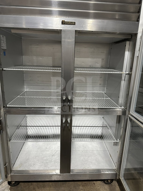Traulsen G21000 commercial reach-in refrigerator, 2-section, 4-half glass doors, stainless steel, poly coated racks, on casters.