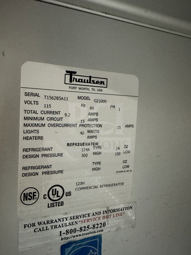 Traulsen commercial reach-in refrigerator, model G21000, SN T156285A11, 2-section, 4-half glass doors, poly-coated wired rack.