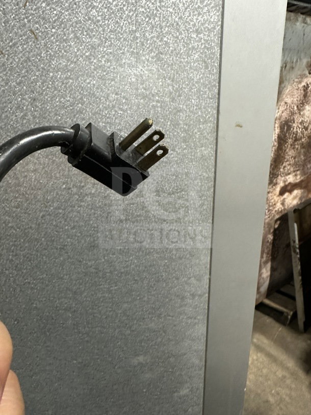 Traulsen commercial refrigerator plug and stainless steel exterior, model G21000, 115V, 1-phase, on casters.