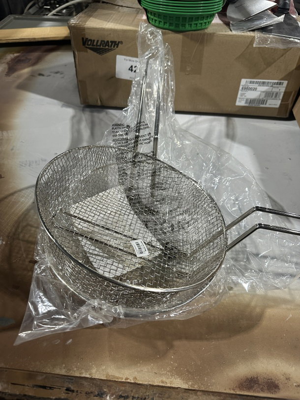 Brand new Winco 10" medium-mesh fry basket, model FB10M. Heavy-duty stainless steel, wrapped in plastic, great for commercial use.