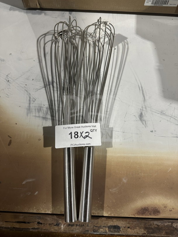 Brand new Winco FN-20 stainless steel French whisk, 20", commercial grade. Visible tag indicates serial number 812944005245.