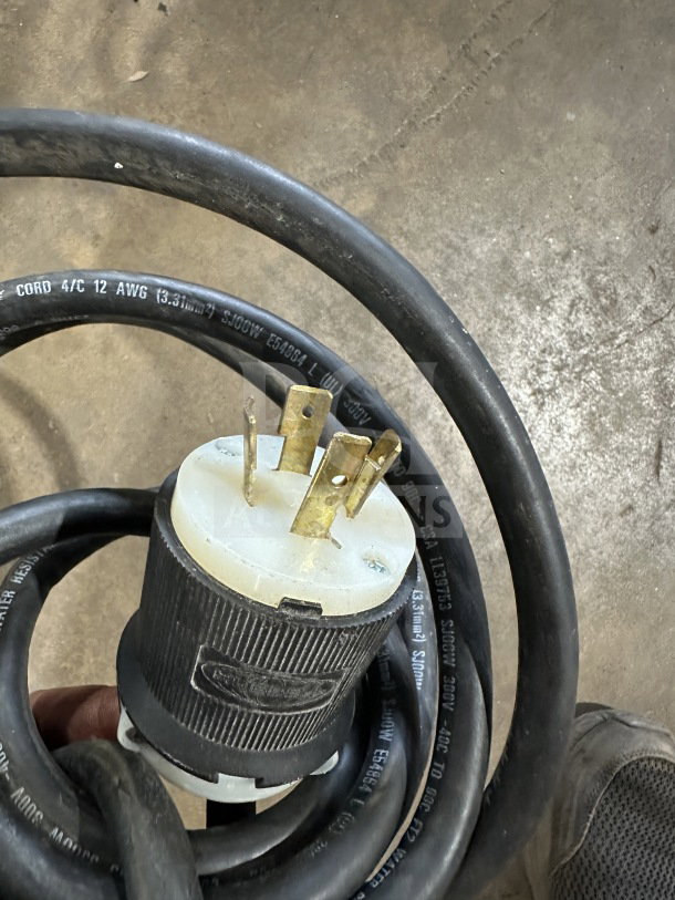Coiled power cord for Amercian Panel AP12BCF1103 blast chiller, with visible plug and cable specifications.
