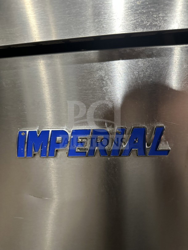 Imperial stainless steel natural gas deep fat fryer, features back splash, on casters, brand logo visible, commercial-grade.