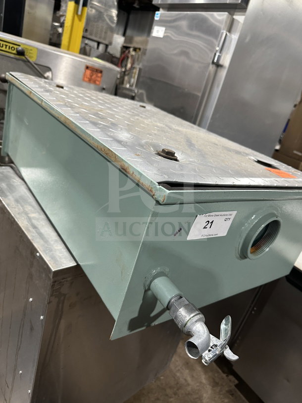 Mifab MIGL20 grease interceptor on stainless steel cart with casters, visible wear, label indicating auction item.
