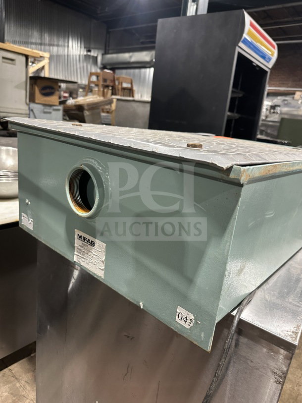 Rare Mifab MIGL20 grease interceptor on custom stainless steel cart with casters, visible labels and model marking.
