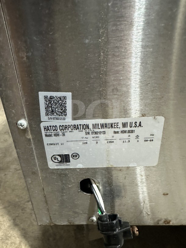 Hatco HDW3N stainless steel 3-drawer warmer, serial number 8736212133, 120V, on casters, with visible tags.