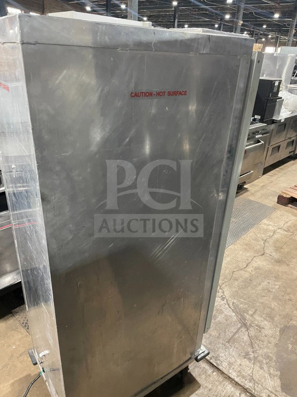 Avantco 177HPU1836 stainless steel heated proofing cabinet, single glass door, built-in pan slides, 120V, on casters.