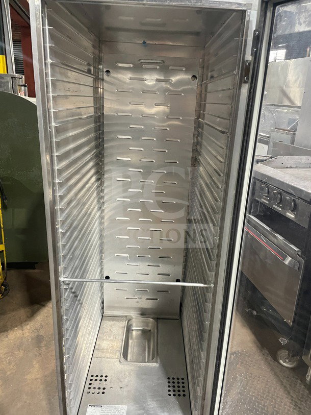 Avantco 177HPU1836 stainless steel heated holding cabinet, full-size, glass door, built-in pan slides, 120V, on casters.