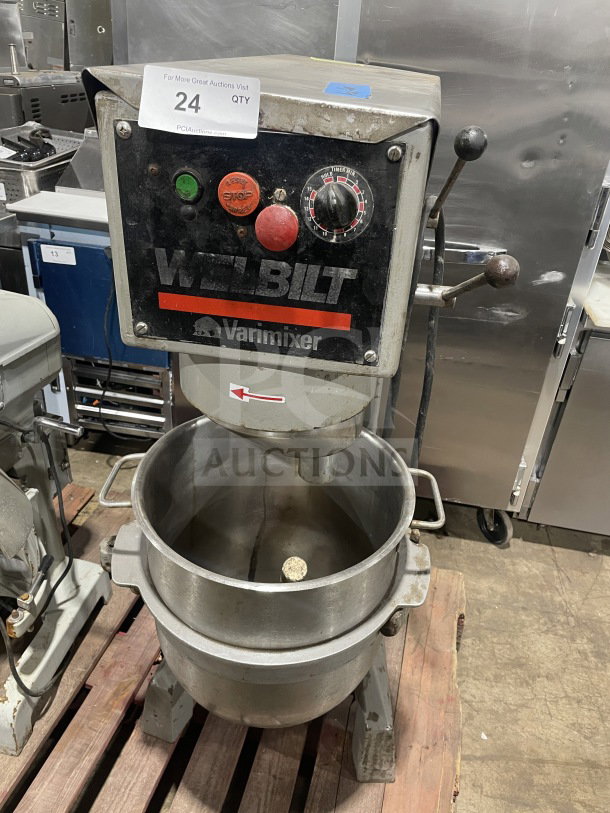 Welbilt Varimixer commercial floor mixer with a dough hook and stainless steel bowl. Features controls and model markings.
