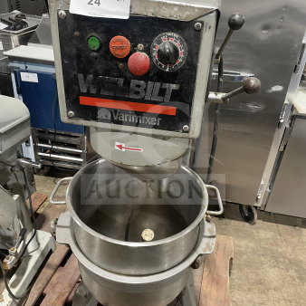 Welbilt Varimixer commercial floor mixer with a dough hook and stainless steel bowl. Features controls and model markings.