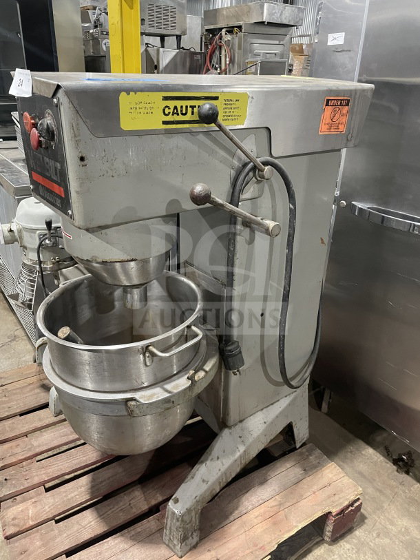 Welbilt Varimixer commercial planetary mixer with dough hook and stainless steel bowl, visible caution labels, used condition.