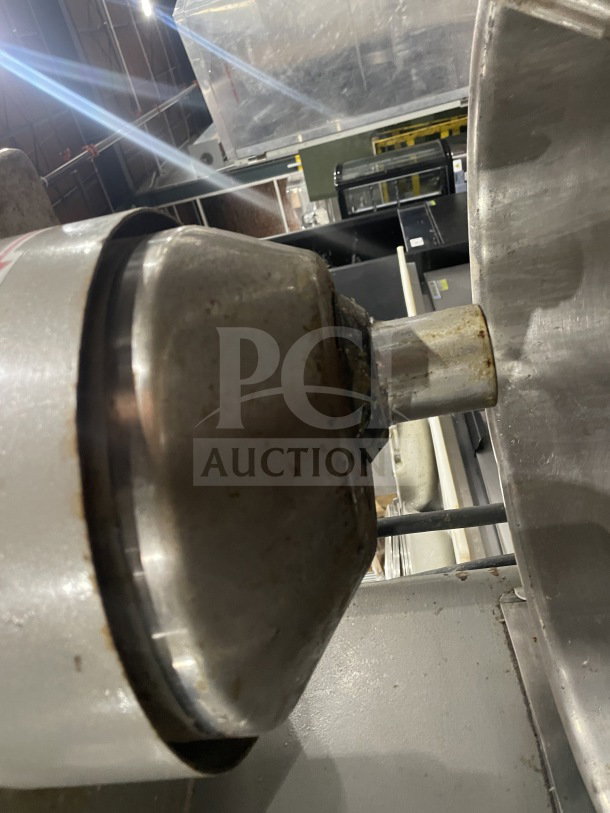 Welbilt Varimixer commercial planetary mixer with dough hook and stainless steel bowl, showing some wear, in industrial setting.