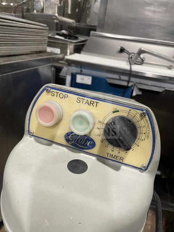 Globe SP20 20Qt heavy-duty mixer with paddle, bowl, and guard. Features visible start/stop buttons and timer control. 110V, 1 phase.