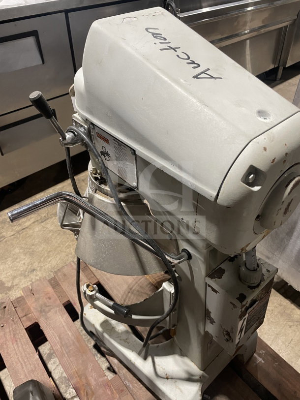 Globe SP20 commercial 20Qt mixer with paddle, bowl, and guard. Heavy-duty, 110V, 1 phase. Visible wear on body.