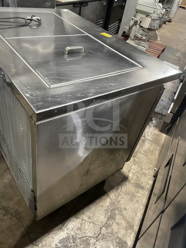 Asber 48" stainless steel electric prep table, model APTM4818, two solid doors, on casters, 115V 1 phase, used condition.