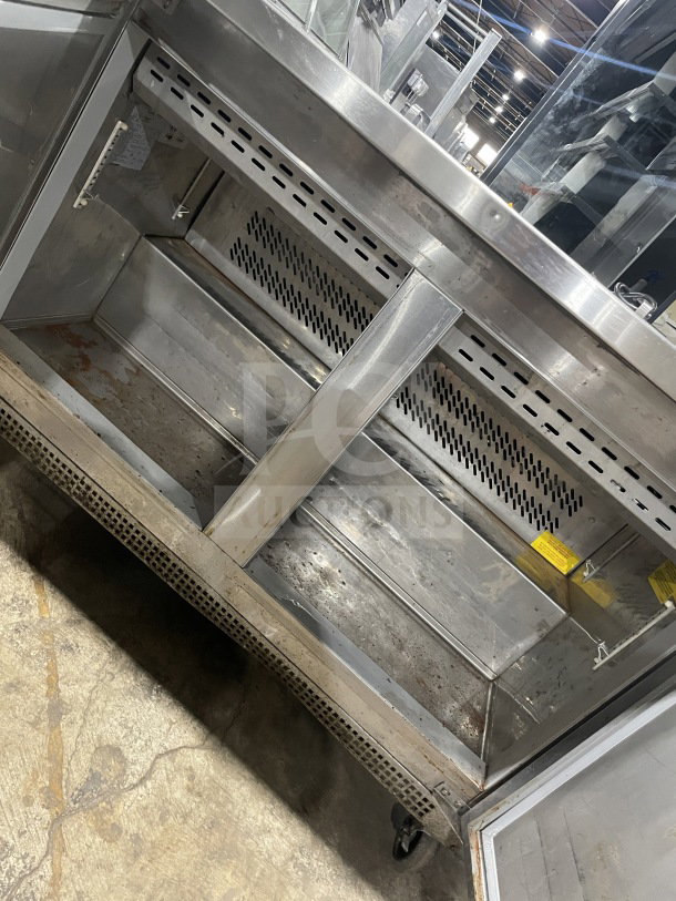 Asber 48" stainless steel sandwich prep table, Model APTM4818, dual solid doors, electric, on casters, interior view.