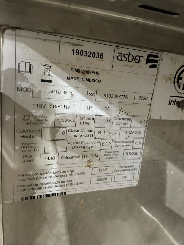 Asber APTM4818 label showing model, serial number 8102087776, 115V, made in Mexico, climate class N, refrigerant R-134a.