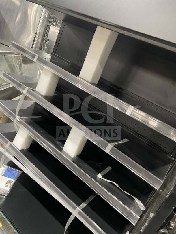 Brand new Avantco 193VOA48B black vertical open air merchandiser, extra deep, on casters, 115V, 1 Phase, minor scratches.