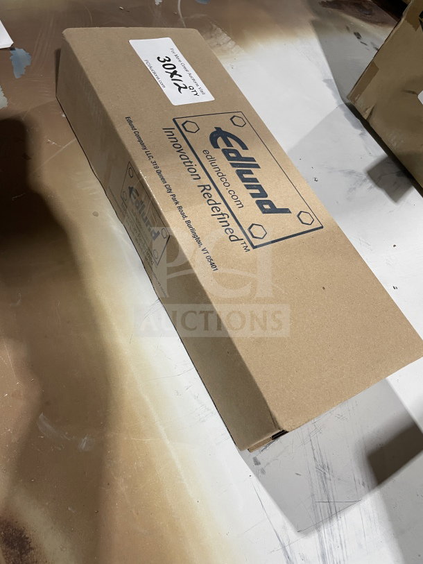 Box of 12 brand-new Edlund Model 34510 stainless steel scalloped utility tongs, 16-inch, with clear Edlund branding.