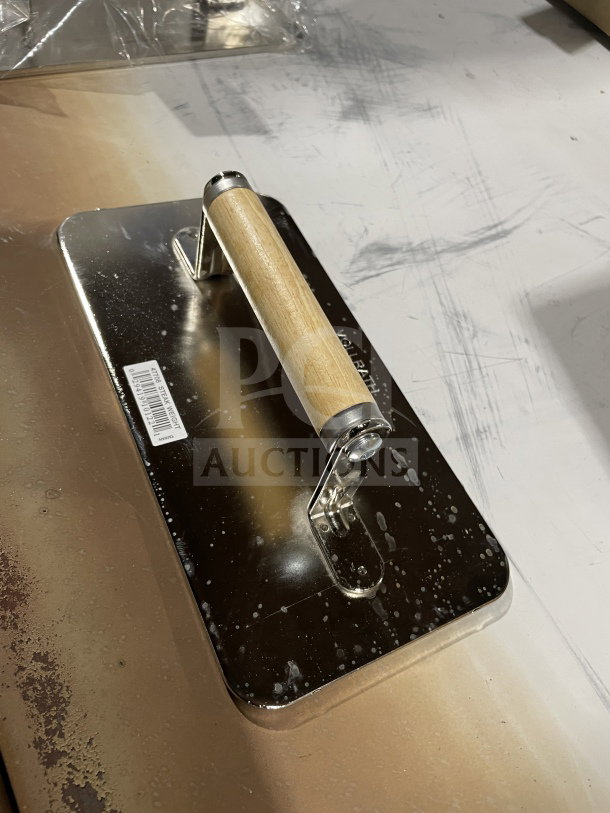 Brand new Vollrath 47708 chrome-plated steel steak weight with waffle-patterned grid, wooden grip handle, and barcode label.