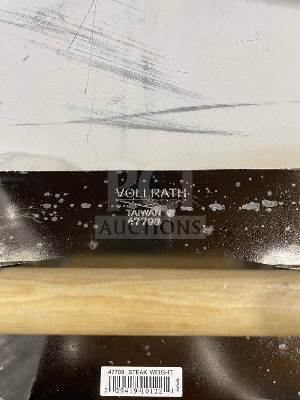 Vollrath 47708 steak weight, chrome-plated steel, waffle-patterned grid bottom, wooden grip handle, marked “Vollrath,” new condition.