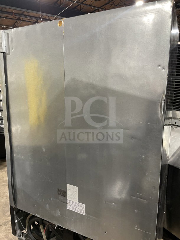 Good condition Kool-It LX46FB commercial black double glass swing door reach-in freezer, poly coated wire rack, on casters.