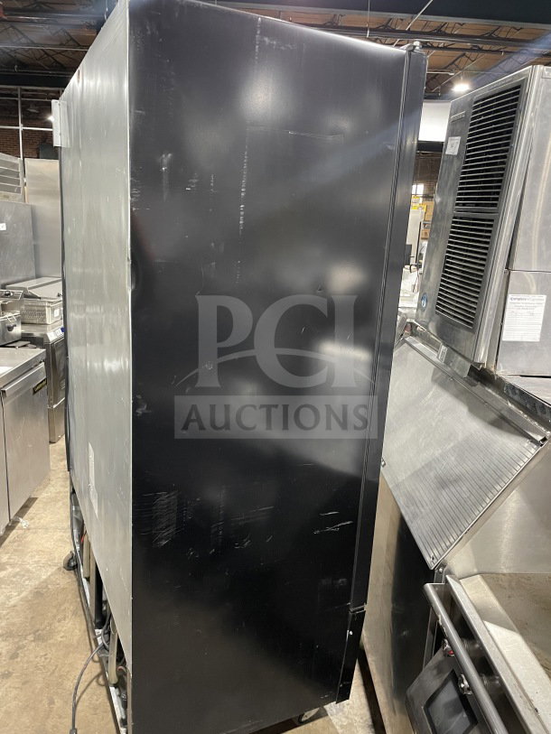 Kool-It LX46FB commercial black freezer, double glass swing doors, poly-coated wired rack, 115V, on casters, SN: H89220200560.