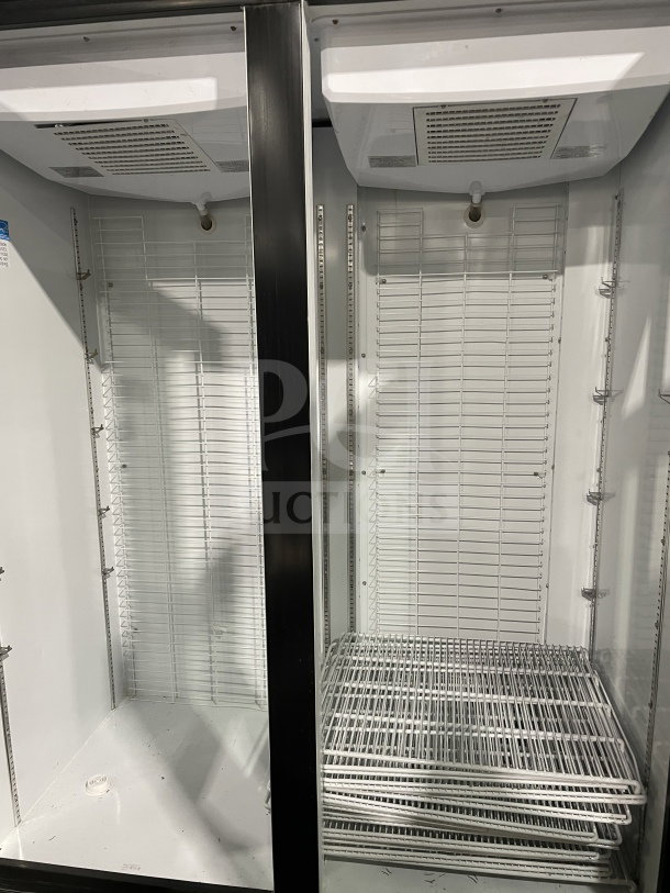 Kool-It LX46FB commercial freezer, black double glass doors, poly-coated wired racks, 115V, on casters, good condition.
