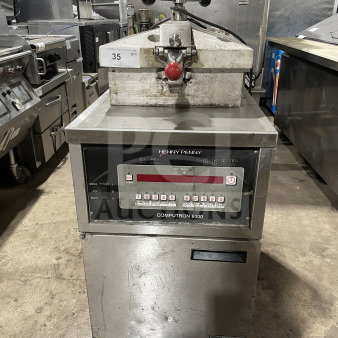 Henny Penny Model 600RB stainless steel gas-powered pressure fryer, on casters. Features visible markings and control panel.