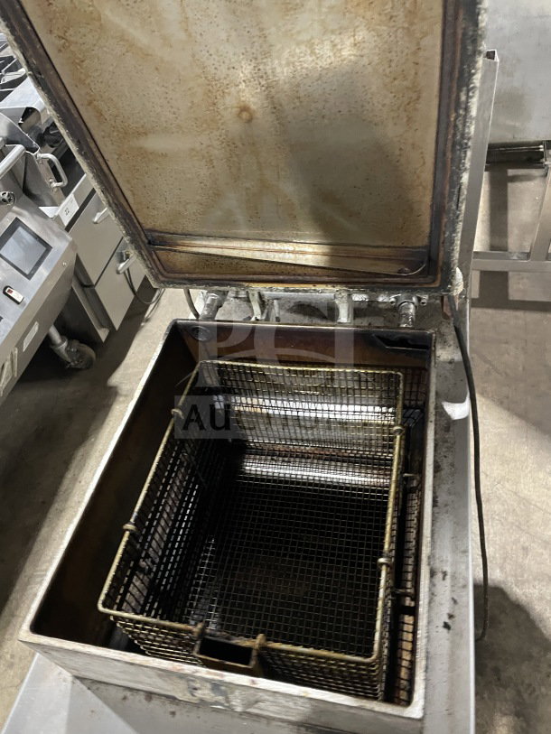 Henny Penny 600RB commercial stainless steel gas pressure fryer, model 600RB, SN:EA023JA, on casters, open lid view.