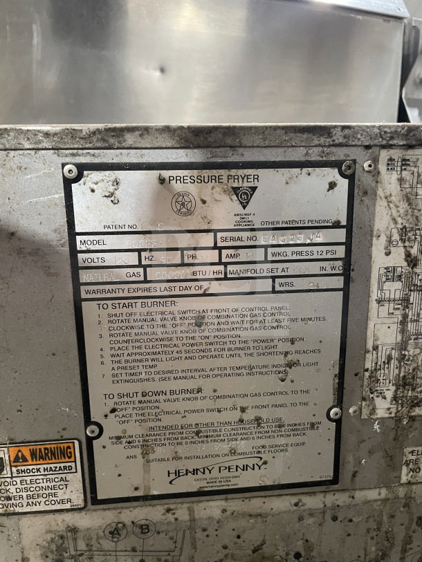 Henny Penny Model 600RB commercial stainless steel pressure fryer. Gas-powered, 120V, 1Phase, on casters. Serial: EA023JA.