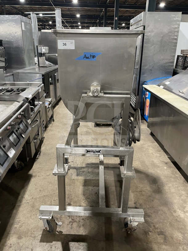 Leland Southwest HD100DA90 stainless steel meat mixer with tilting, counter-rotate action, on casters, in used condition.