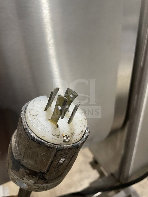 Leland Southwest HD100DA90 meat mixer's power plug, showcasing casters and stainless steel body in good condition.