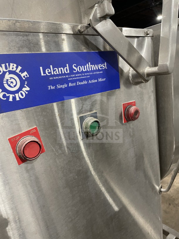 Leland Southwest HD100DA90 stainless steel meat mixer with tilting, double action, buttons, and casters. Model visible.
